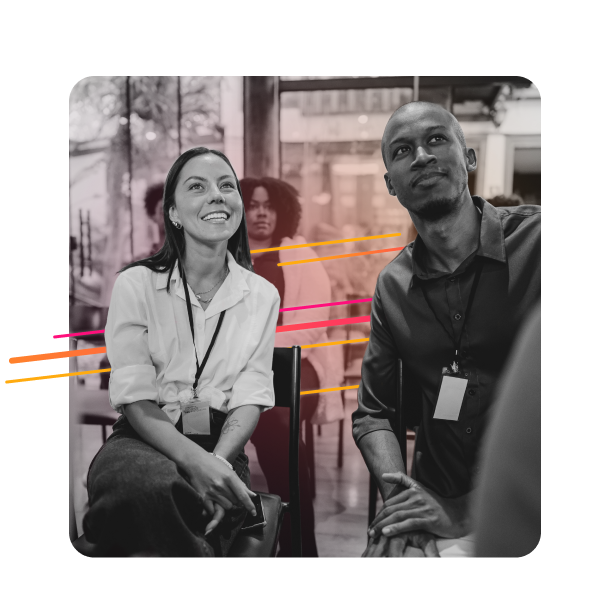 Close-up of two attendees at a conference.